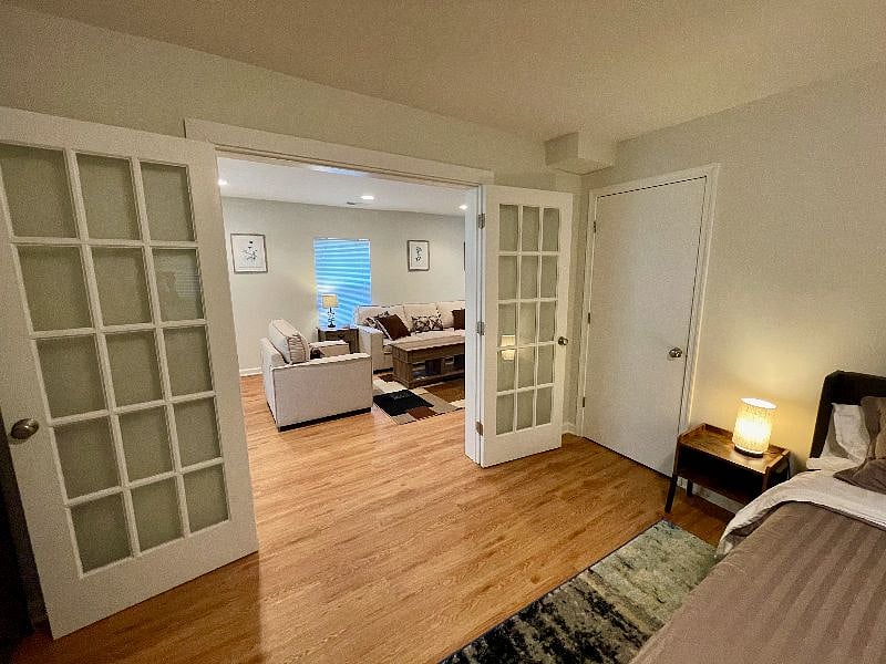 French doors leading from the master bedroom to the living room area.
