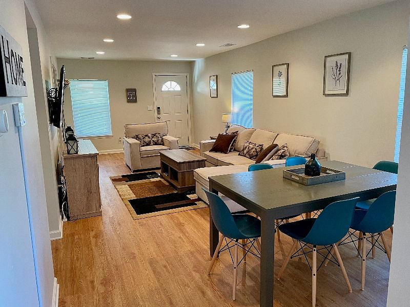 The open floor plan has space for lounging, eating, and working!