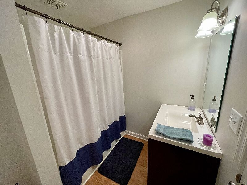 The downstairs full bathroom has a tub/shower combination.