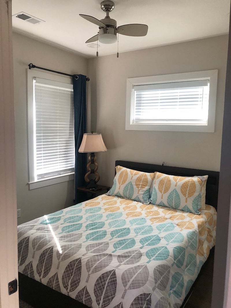 Master bedroom with queen bed and ample storage space under the bed