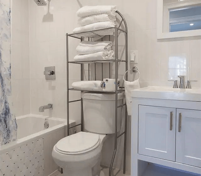 Fully tiled family bathroom with combined bath and shower