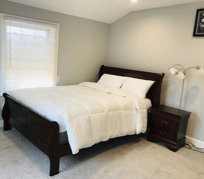 Modern and charming bedroom with a nightstand and lamp