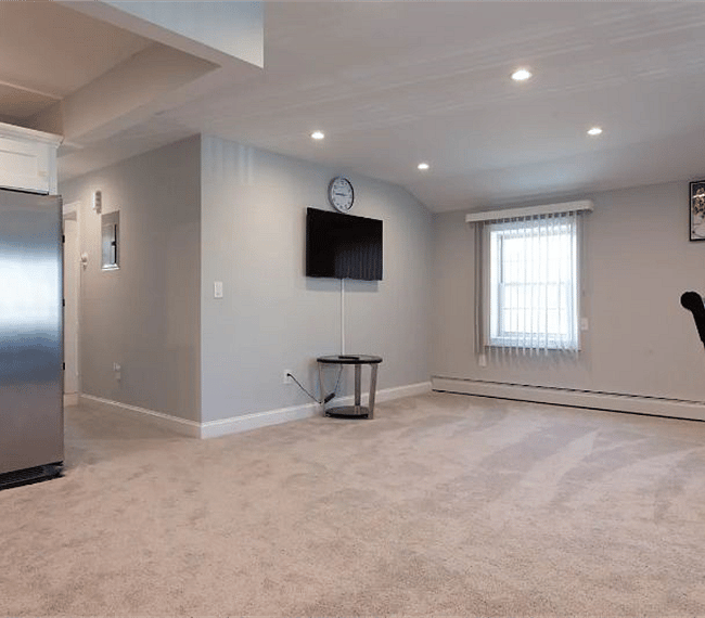 Bright and spacious living room with flat screen TV