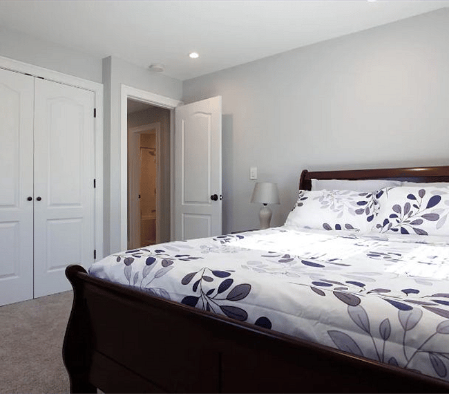 Bright and airy bedroom with full closet organizer