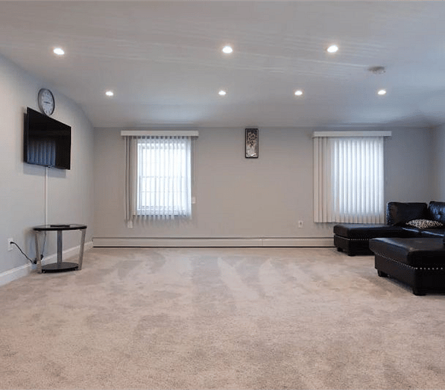 Bright and spacious living room with flat screen TV