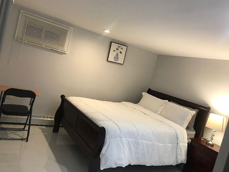 Spacious and warm bedroom with study/work space