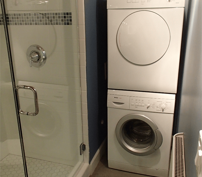 Washer and dryer are located in the bathroom