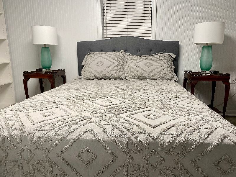 Spacious and cozy bedroom with nightstands and lamps