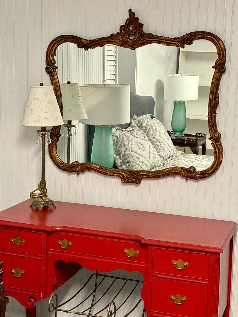 Tastefully decorated with a dresser and mirror