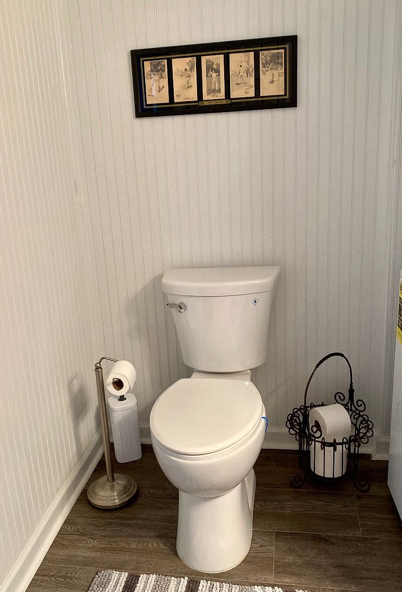 The bathroom is modern and stylish with shower, toilet and vanity