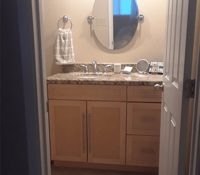 The bathroom is modern and stylish with shower, toilet and vanity