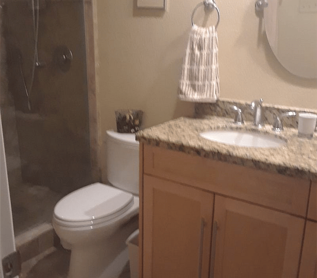 Fully tiled bathroom with a shower 