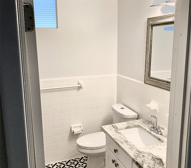 Full bathroom with bathtub and shower off of the hallway