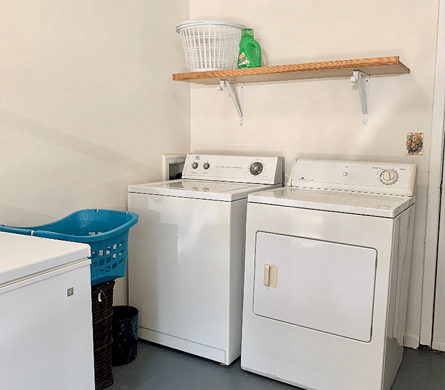 Laundry room located in the garage