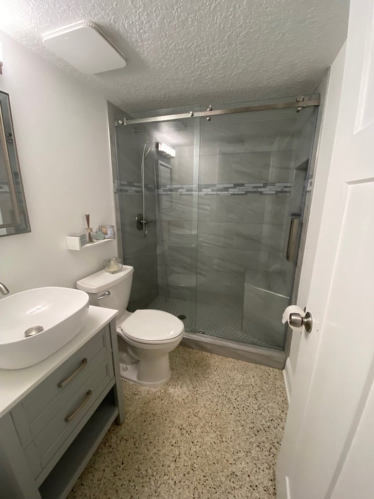 Deep vessel sinks under sink storage. Comfort height commode with slow close lid.