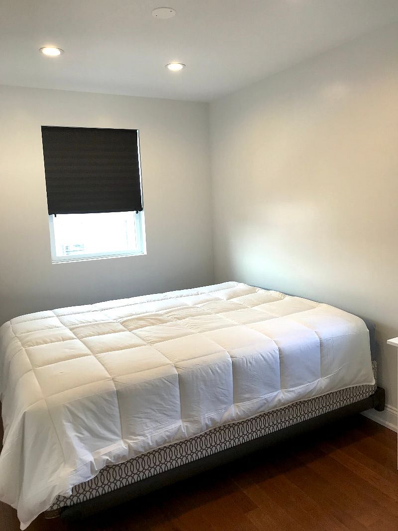 2nd bedroom, with 2 windows and queen bed.