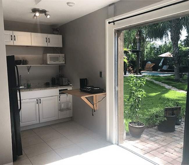 Functional kitchenette overlooking to the swimming pool
