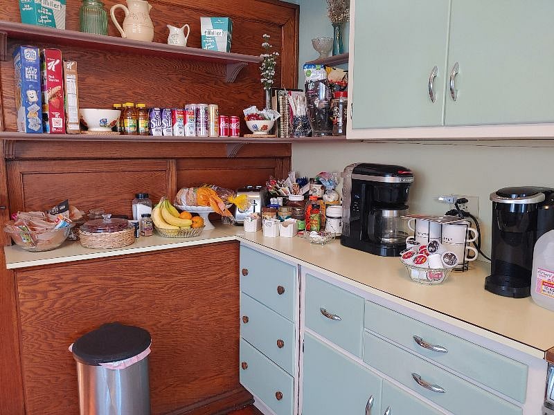 Kitchen Breakfast area with oatmeal, grits, coffees and teas, breads,,  cereals,  and fruit provided.