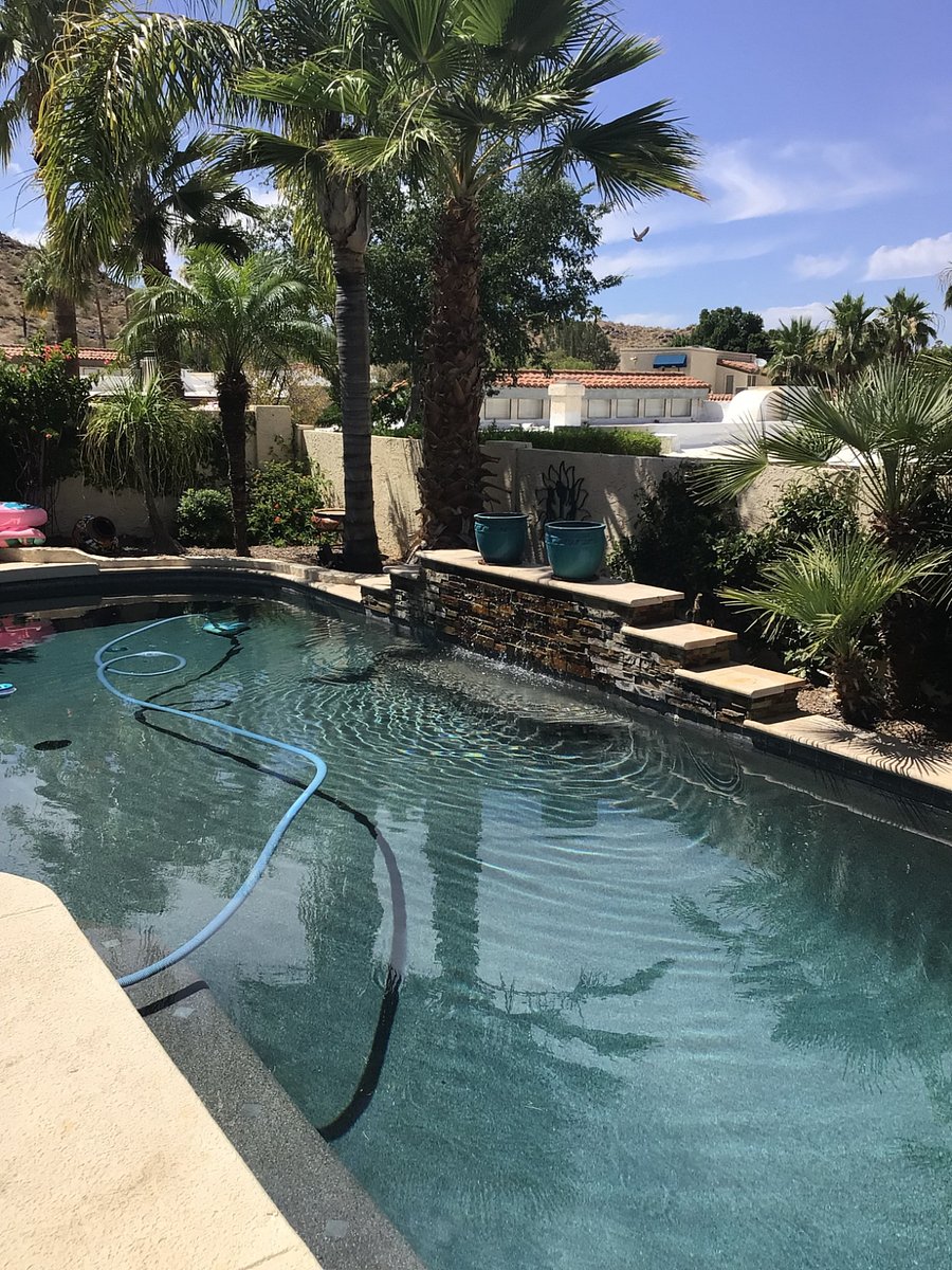 The pool has a beautiful fountain. it's a pebleteck pool with bench seating all around, even under the fountain.