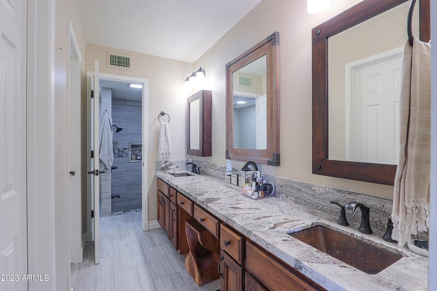 newly remodeled master bath with two walk in closets.
