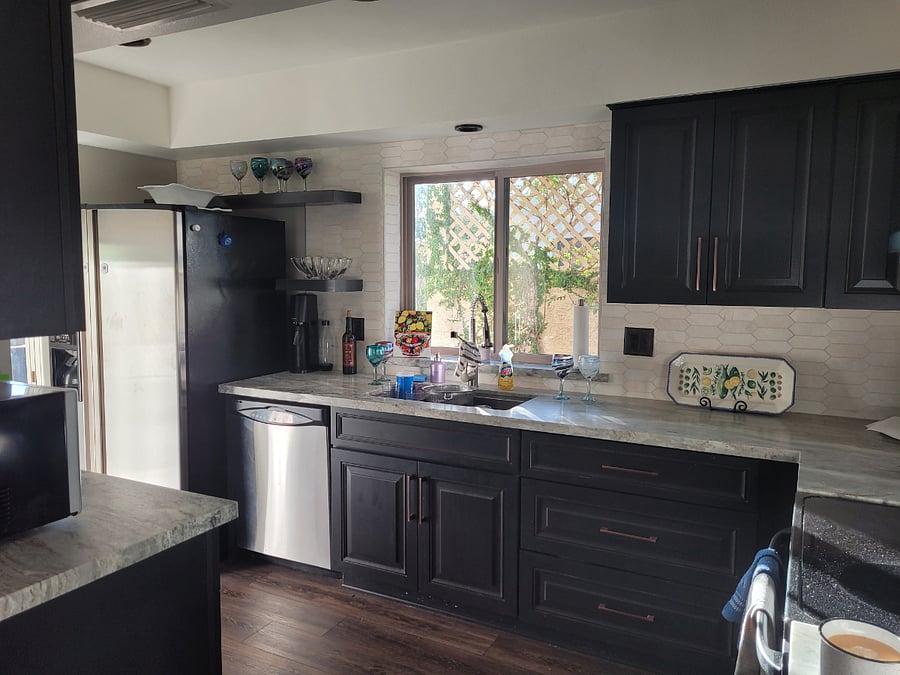 Fully appointed kitchen with views of the patio