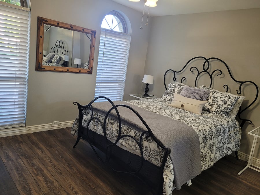 spacious guest bedroom on the main floor, with views of the courtyard.