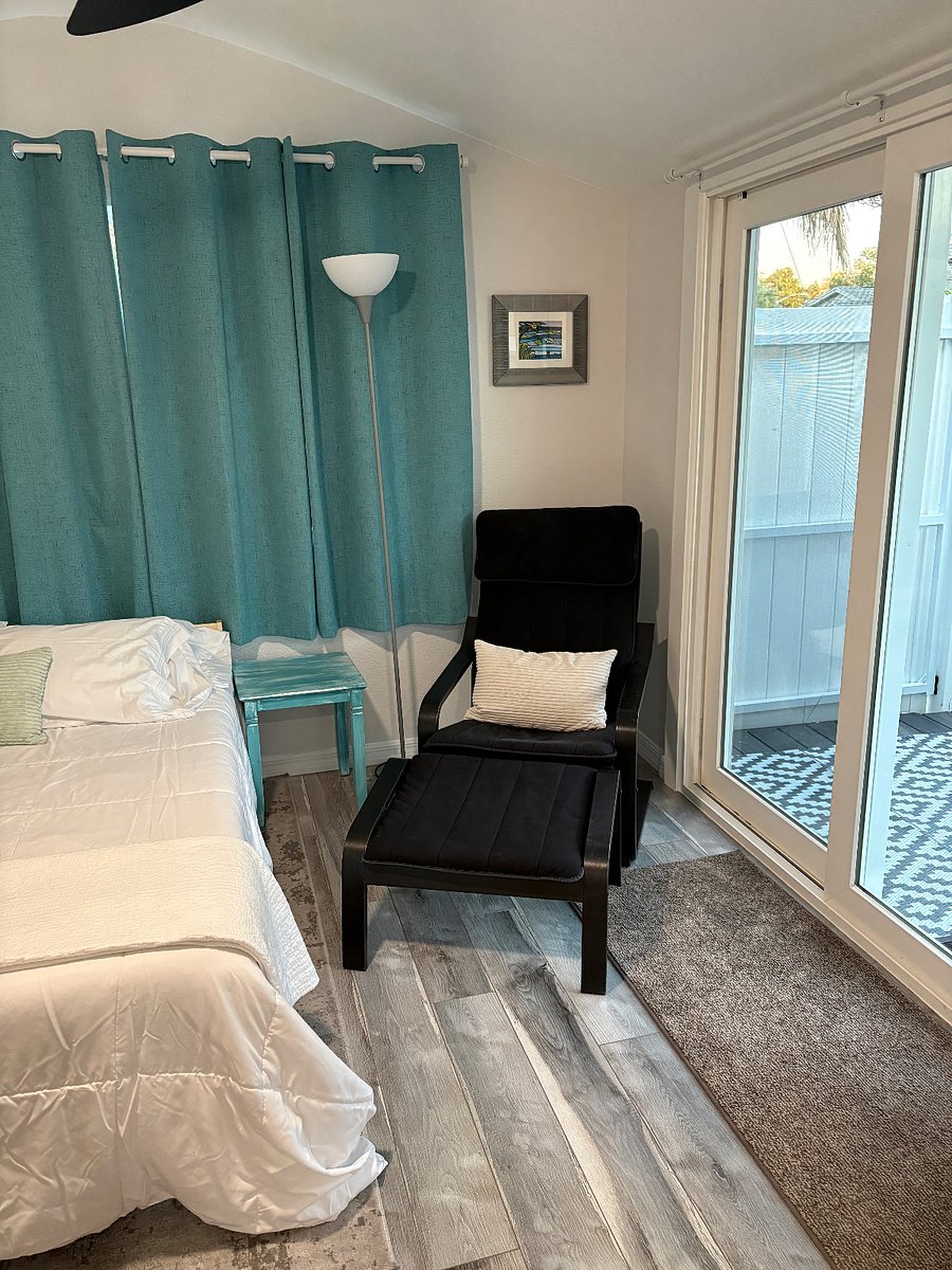 Black out curtains, brand new full sized mattress and frame; IKEA chair and ottoman. 