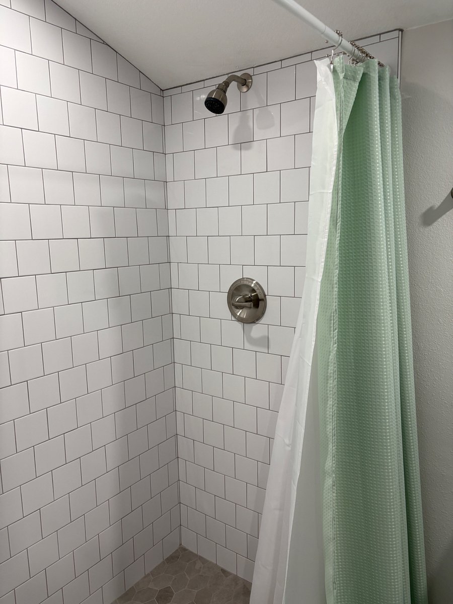 Brand new tile work in shower. 