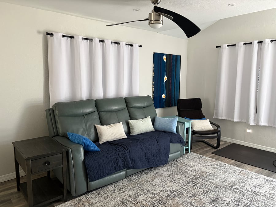 Living room, with couch, 2 recliners on each end; lounge chair 