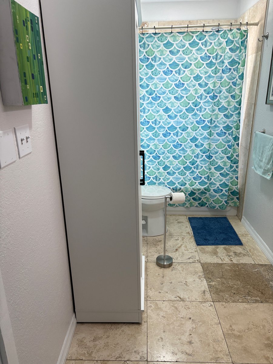 Bathroom shows storage cabinet