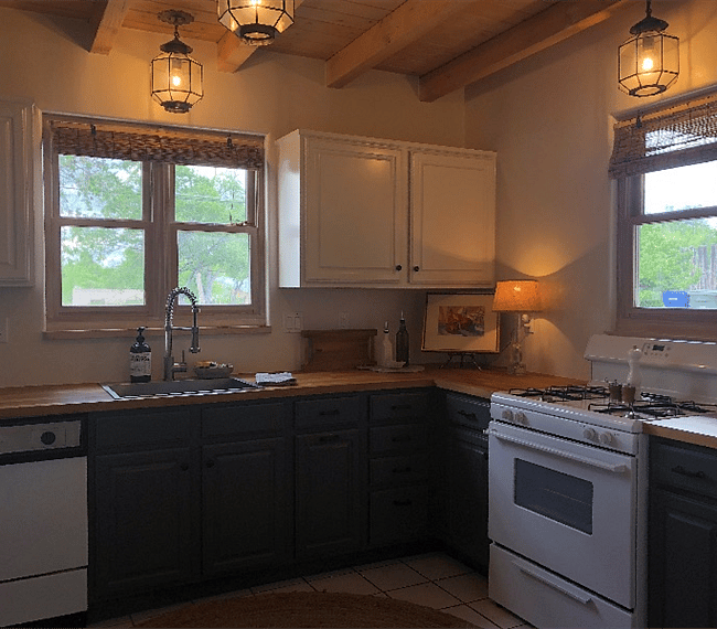 Kitchen with gas range and farmhouse sink, butcher block counters