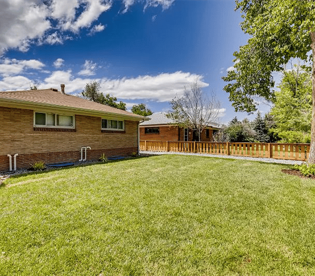 Fully fenced and professionally landscaped yard.