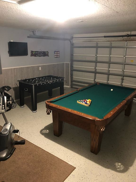 Remodeled garage which includes 8ft. slate pool table and foosball table