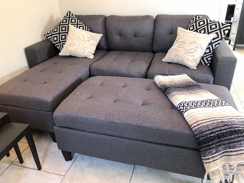 The living room couch converts into a full size mattress.