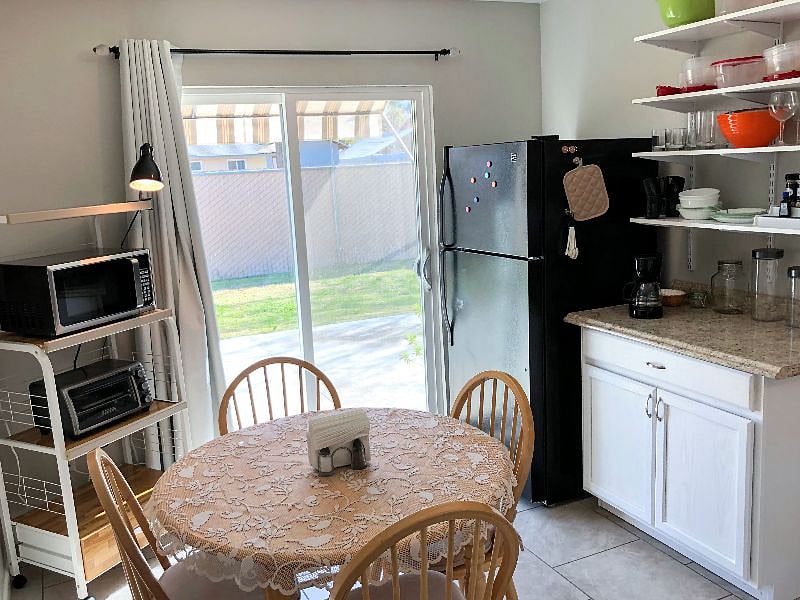 From your kitchen table, sliding doors beckon you outside...