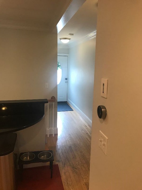 Entry door / hallway from the kitchen; Nest thermostat, wired surround sound.
