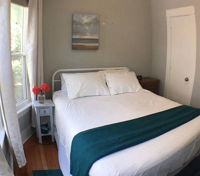 First bedroom with queen bed; roses from our garden