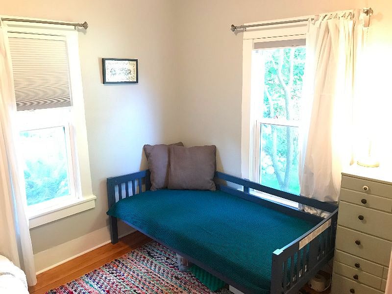 Bright second bedroom with two twin beds.  Blackout shades, large closet. 