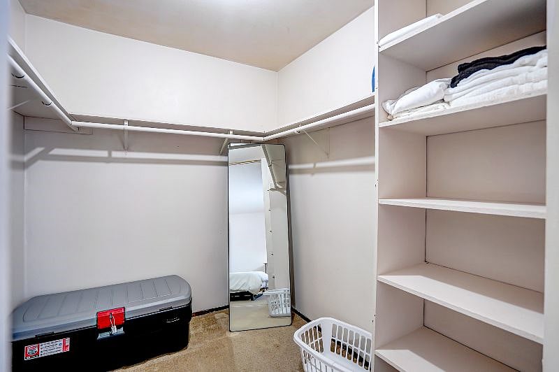 Closet with plenty of hanger space and full body mirror!
