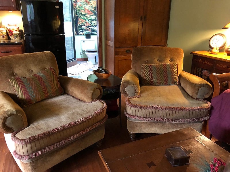 Two large, deep, down-filled designer armchairs provide generously comfortable seating for guests of all proportions.