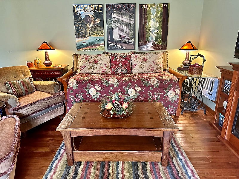 The main seating area features a twin size daybed sofa with a memory foam topper plus a second twin pop-up trundle stored below it.