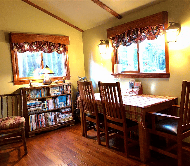 The table and chairs here are multipurpose, functioning as a dining set, study desk, work station or a quiet reading area. Its lovely view of the sunlit patio is quite exceptional!