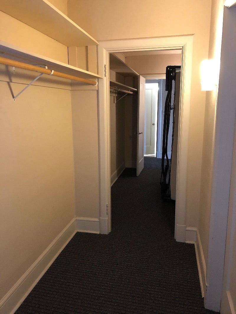 Walk in closet with Murphy bed that folds down into living room for guests 
