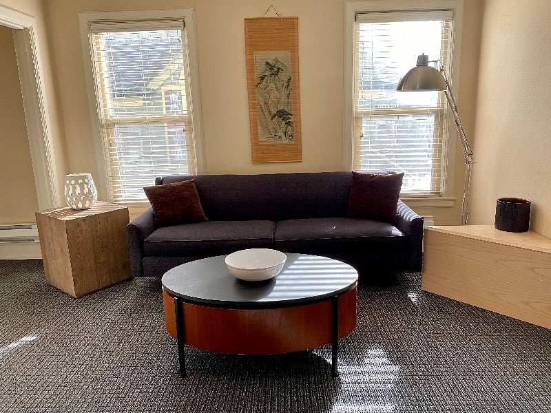 Light floods into living room from the 3'x5' windows 