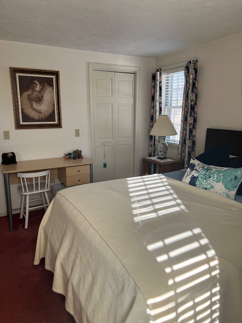 Queen room with shared bathroom