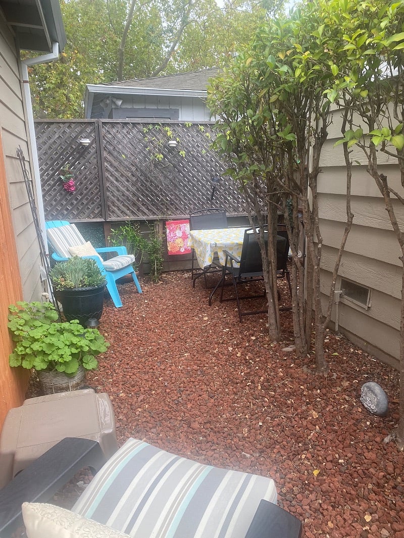 Small Sitting Area with Table , 4 Folding Chairs & 2 Adirondack Chairs with Cushions.