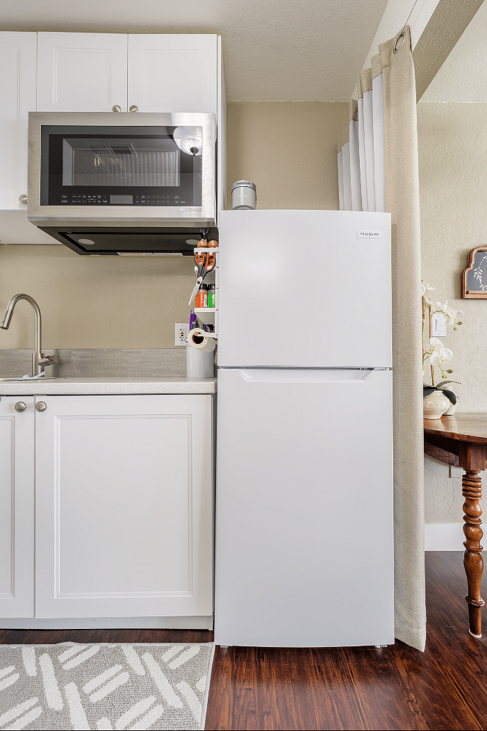 Well-appointed kitchenette with 2-burner cooktop, high end convection oven & microwave oven combo, and full sized fridge