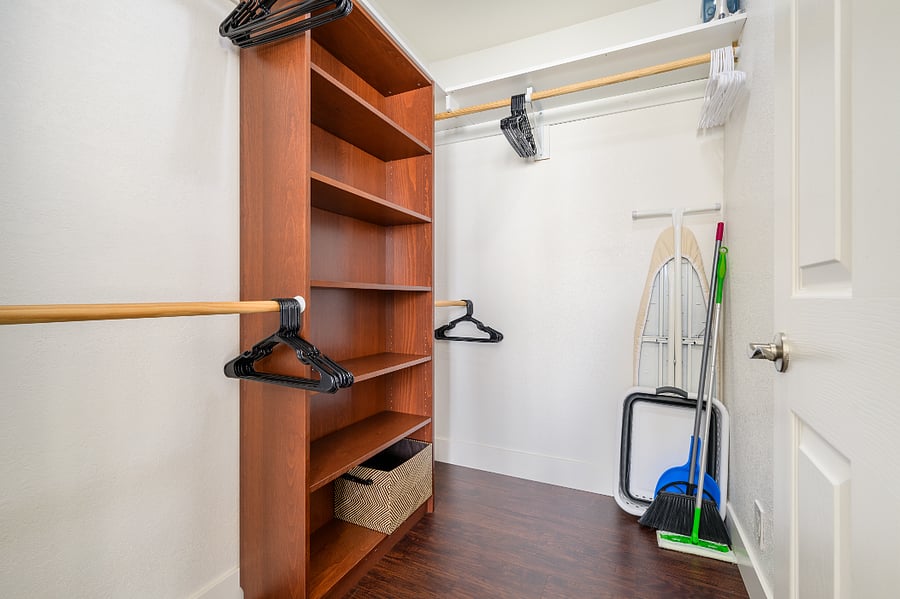 Large walk-in closet, plenty of storage. Includes iron, ironing board, collapsible laundry basket, swiffer & wipes, broom & dustpan.