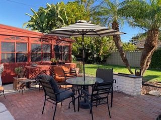 Brick patio sitting & dining with BBQ