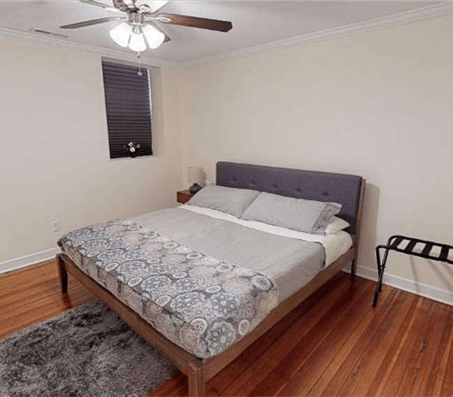 Master Bedroom with king bed, Roku TV, ample closet space, ensuite bathroom, desk & chair.